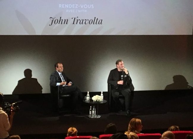 “That’s what I do. I take risks,” John Travolta tells French audiences at Cannes
