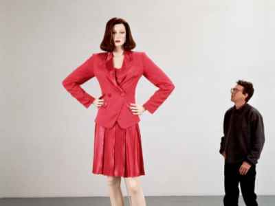 Charles Ray's sculpture of a tall woman in an all red outfit