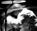 Black and white stage shot of Ralphe Rolle on the drums
