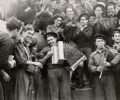 Republican sailors playing musical instruments on board the battleship Jaime I, Almería, Spain. February 1937