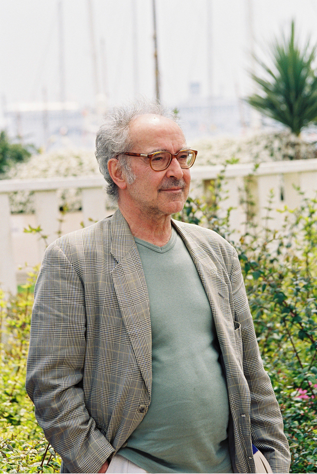 French director Jean-Luc Godard pose at the Palais des Festivals during the photocall of 'L'Eloge de l'Amour'