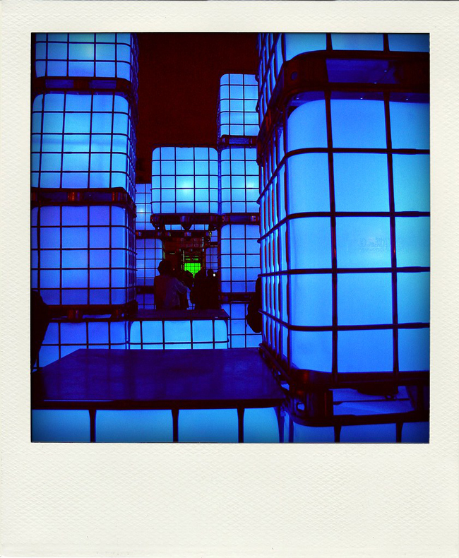 Polaroid of neon blue squares against the night sky in Nuit Blanche Paris