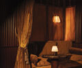 Warm brown sofa with velvet curtain