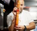 David-Toutain-ChefHoldingLangosstine_RDT_Oct19_2021_France-e1677047405396